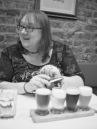 Elena and a flight of Belgian beers
