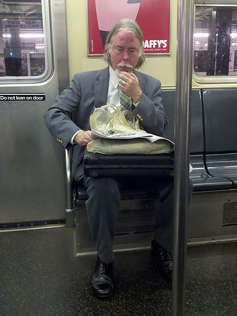 Eighth Avenue IND: reading the funny pages