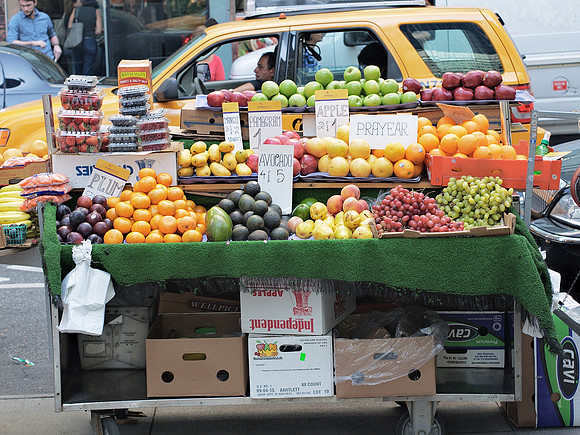 Fruit stand and taxi, West 43rd Street