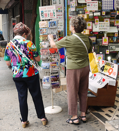 Buying postcards, Eighth Avenue