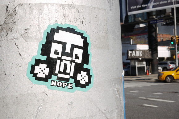 Sicker on a streetlight pole, Hell's Kitchen