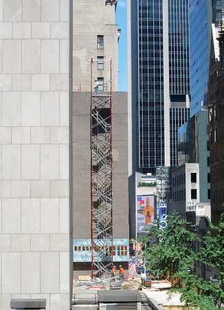 Construction workers and the National Debt Clock, West 44th Street